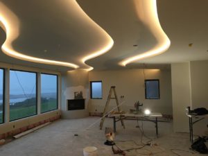 Curvy ceiling under construction with lighting at the coast